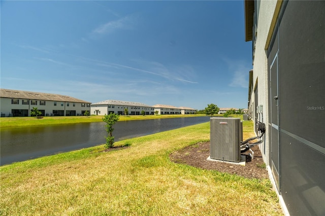15242 Sunny Day Dr, Bradenton, FL 34211 - exterior space featuring a residential view, a water view, and central air condition unit