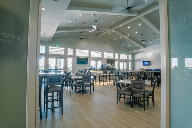 15242 Sunny Day Dr, Bradenton, FL 34211 - dining space featuring ceiling fan, wood finished floors, high vaulted ceiling, and beam ceiling