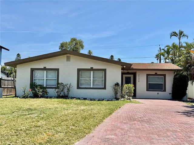 3735 Alabama Ave NE, Saint Petersburg, FL 33703 - single story home with a front yard, stucco siding, and fence