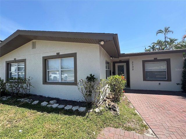 3735 Alabama Ave NE, Saint Petersburg, FL 33703 - single story home with stucco siding and a front lawn