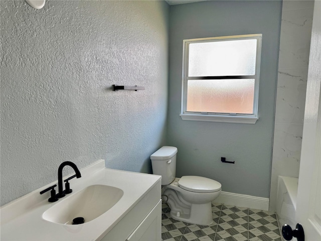 3735 Alabama Ave NE, Saint Petersburg, FL 33703 - full bath featuring tile patterned floors, toilet, a bath, vanity, and baseboards