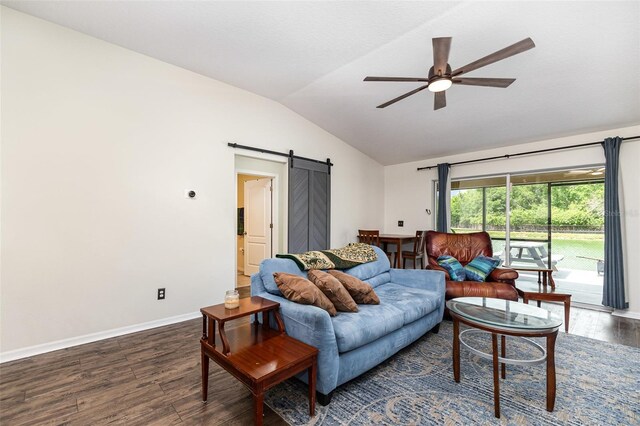 living area featuring a barn door, a ceiling fan, baseboards, wood finished floors, and lofted ceiling