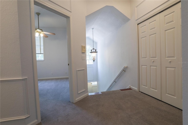 7613 Bay Port Rd Unit 34, Orlando, FL 32819 - hall featuring an upstairs landing, carpet floors, and baseboards