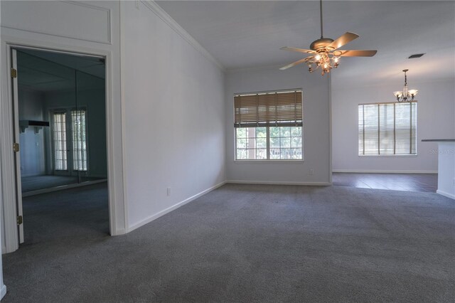 7613 Bay Port Rd Unit 34, Orlando, FL 32819 - unfurnished room with ornamental molding, carpet flooring, baseboards, and ceiling fan with notable chandelier