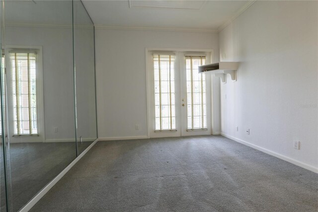 7613 Bay Port Rd Unit 34, Orlando, FL 32819 - empty room featuring ornamental molding, carpet flooring, and baseboards