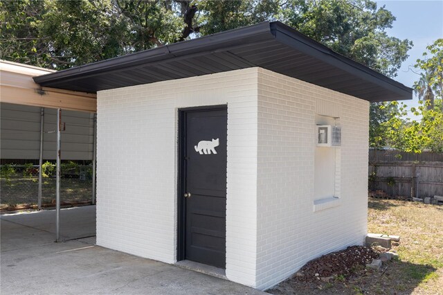 view of outdoor structure featuring an outdoor structure and fence