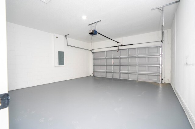 garage featuring electric panel and a garage door opener