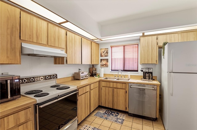 kitchen with range with electric stovetop, under cabinet range hood, stainless steel dishwasher, freestanding refrigerator, and black microwave