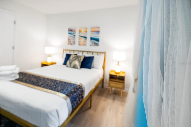 bedroom featuring wood finished floors