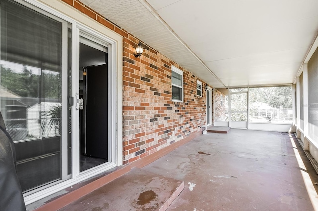 unfurnished sunroom featuring plenty of natural light
