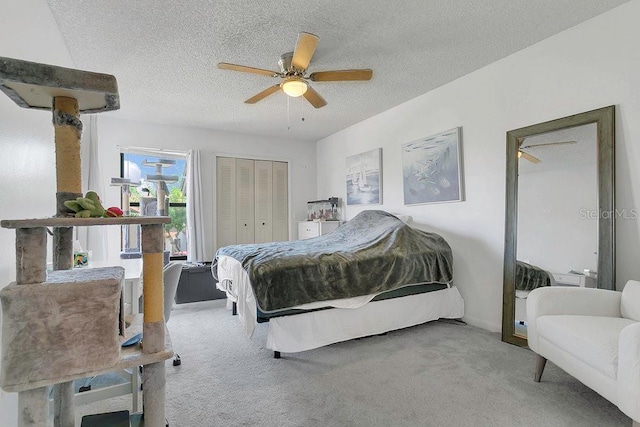 3106 S Semoran Blvd Unit P-2, Orlando, FL 32822 - carpeted bedroom featuring a textured ceiling, a closet, and ceiling fan