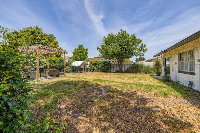 view of yard featuring a fenced backyard and a pergola