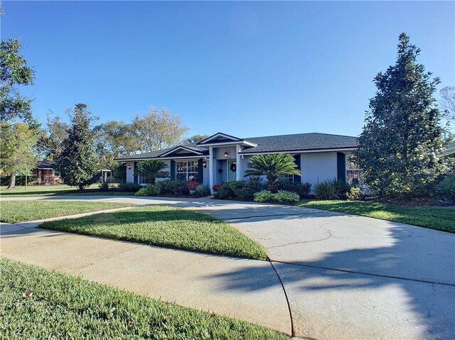 1644 Hibiscus Ave, Winter Park, FL 32789 - ranch-style house featuring a front lawn