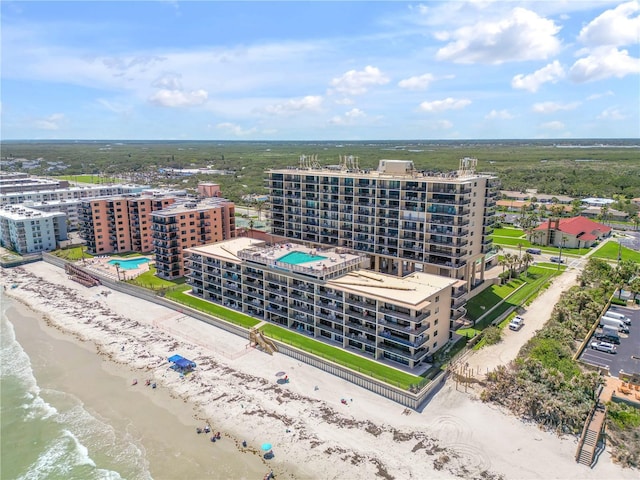 4139 S Atlantic Ave Unit B707, New Smyrna Beach, FL 32169 - drone / aerial view with a water view and a beach view