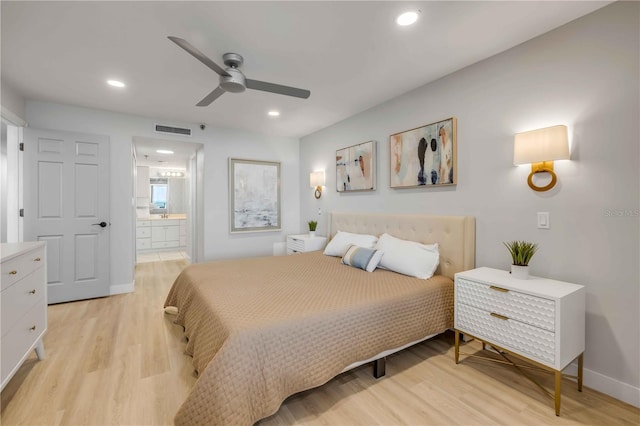 4139 S Atlantic Ave Unit B707, New Smyrna Beach, FL 32169 - bedroom featuring visible vents, recessed lighting, light wood-style floors, and ensuite bath