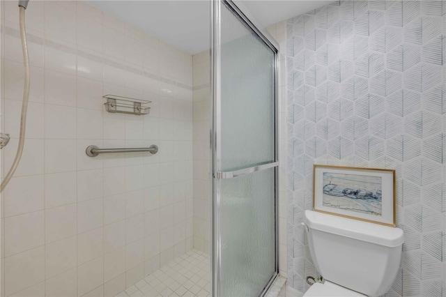 4139 S Atlantic Ave Unit B707, New Smyrna Beach, FL 32169 - bathroom with a stall shower and toilet