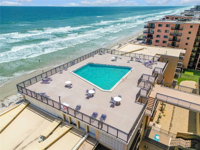 4139 S Atlantic Ave Unit B707, New Smyrna Beach, FL 32169 - pool featuring fence, a patio, a beach view, and a water view