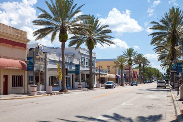 4139 S Atlantic Ave Unit B707, New Smyrna Beach, FL 32169 - view of road with curbs, street lights, and sidewalks