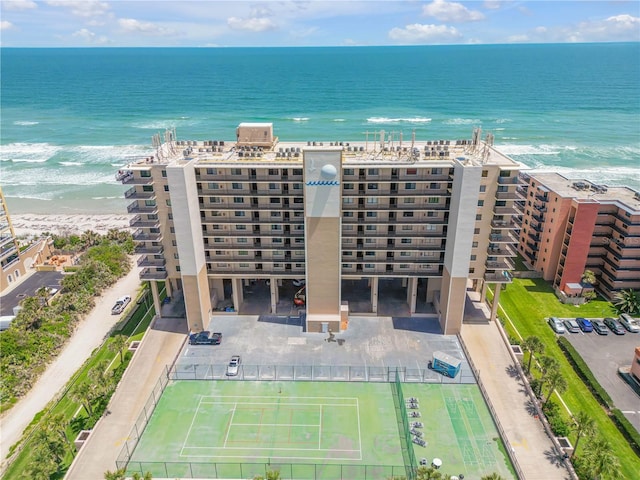 4139 S Atlantic Ave Unit B707, New Smyrna Beach, FL 32169 - drone / aerial view featuring a water view and a view of the beach