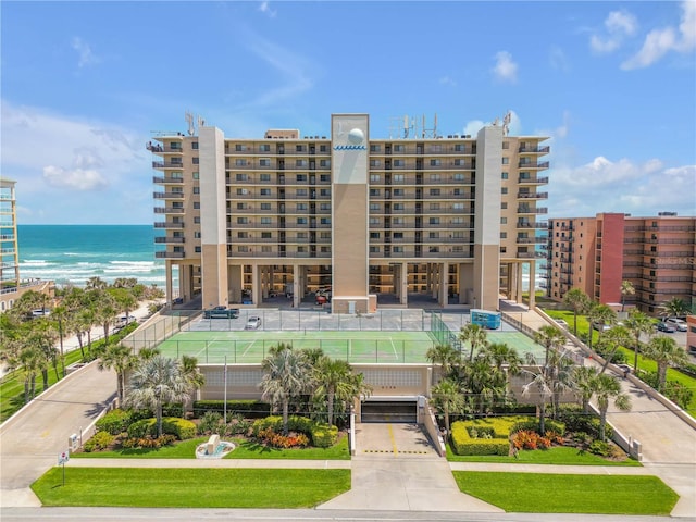 4139 S Atlantic Ave Unit B707, New Smyrna Beach, FL 32169 - view of property featuring a water view, driveway, and a garage