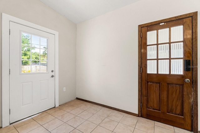 6021 Navajo Way, Orlando, FL 32807 - entryway with light tile patterned floors and baseboards