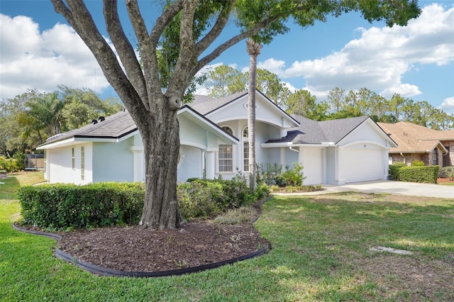 336 Plantation Club Dr, Debary, FL 32713 - single story home with concrete driveway, stucco siding, an attached garage, and a front lawn