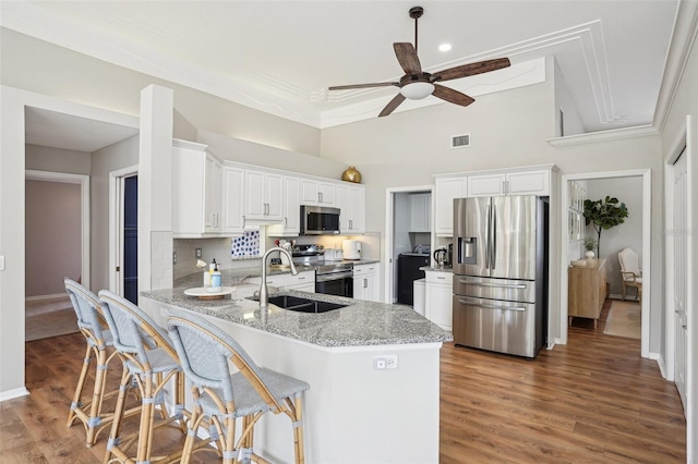 336 Plantation Club Dr, Debary, FL 32713 - kitchen featuring a ceiling fan, visible vents, light stone countertops, a peninsula, and stainless steel appliances