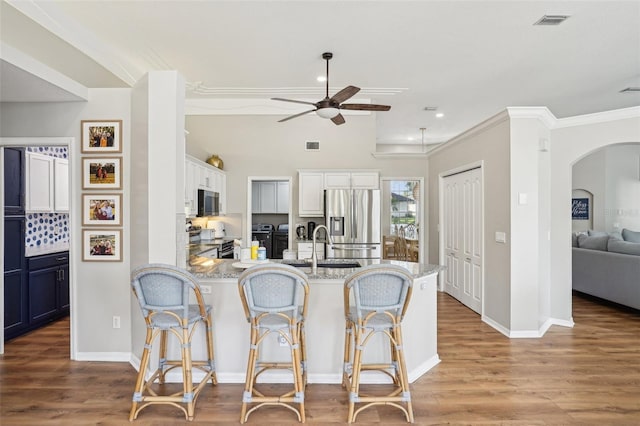 336 Plantation Club Dr, Debary, FL 32713 - kitchen featuring a ceiling fan, appliances with stainless steel finishes, a peninsula, recessed lighting, and light wood-style flooring
