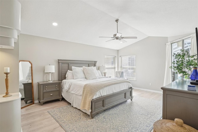 336 Plantation Club Dr, Debary, FL 32713 - bedroom featuring baseboards, light wood-style flooring, vaulted ceiling, and multiple windows