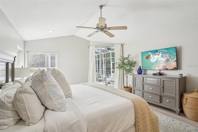 336 Plantation Club Dr, Debary, FL 32713 - bedroom with light wood-style floors, multiple windows, vaulted ceiling, and access to outside