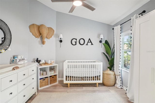 336 Plantation Club Dr, Debary, FL 32713 - bedroom featuring a nursery area, baseboards, light wood-type flooring, and lofted ceiling