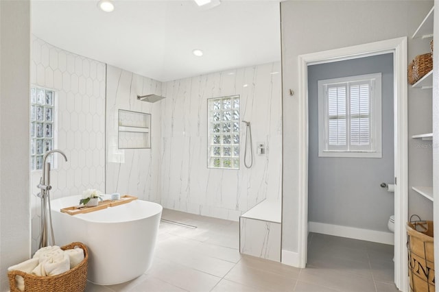 336 Plantation Club Dr, Debary, FL 32713 - bathroom with a freestanding tub, a marble finish shower, tile patterned floors, and toilet