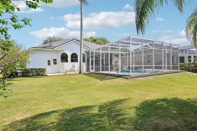 336 Plantation Club Dr, Debary, FL 32713 - back of house with a lawn, a lanai, an outdoor pool, and stucco siding
