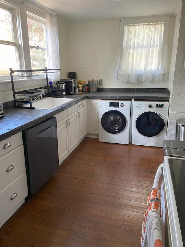 209 E 4th St, Sanford, FL 32771 - laundry area featuring a sink, laundry area, dark wood-type flooring, and washer and dryer