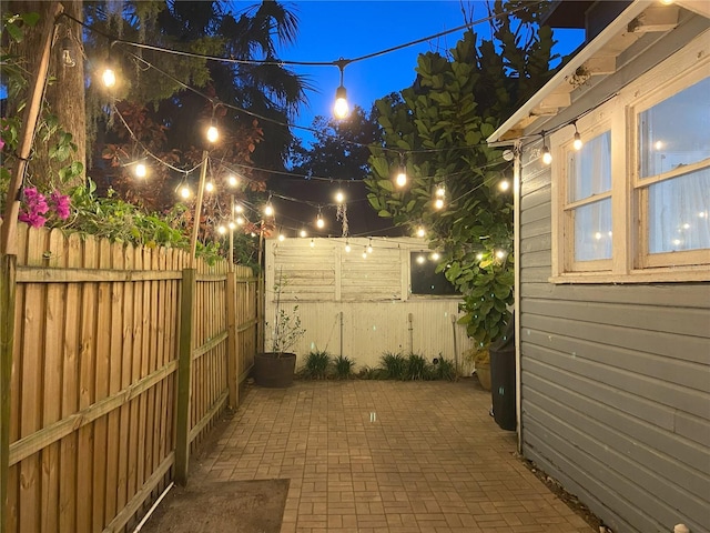 209 E 4th St, Sanford, FL 32771 - patio at night featuring fence