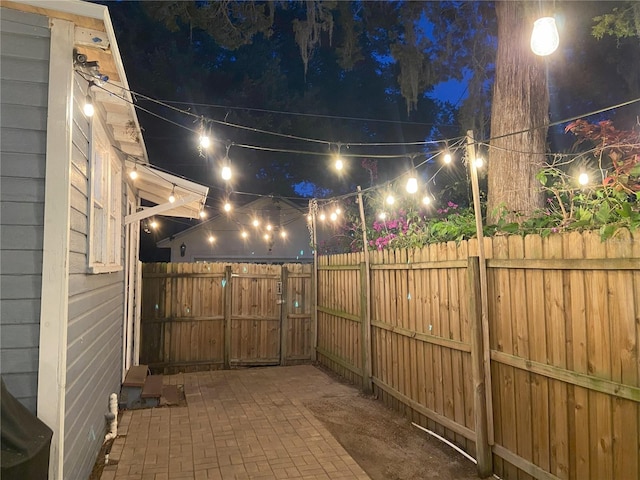 209 E 4th St, Sanford, FL 32771 - patio at twilight featuring a fenced backyard