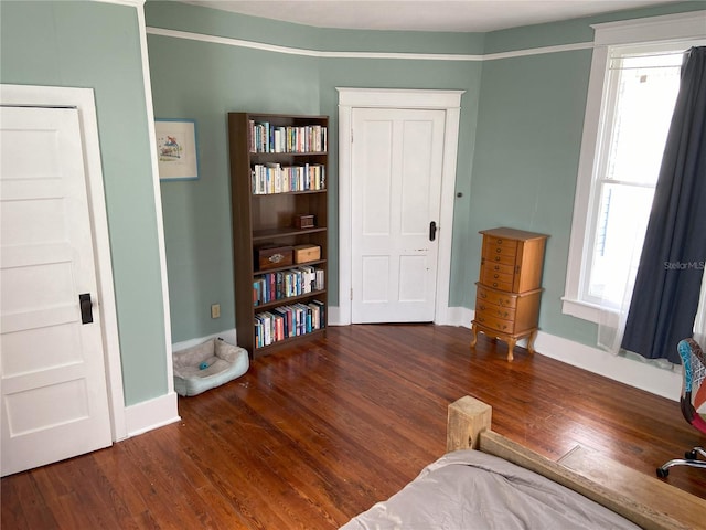 209 E 4th St, Sanford, FL 32771 - sitting room featuring baseboards, wood finished floors, and a wealth of natural light