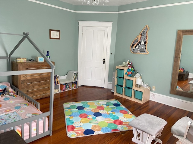 209 E 4th St, Sanford, FL 32771 - bedroom with baseboards and wood finished floors