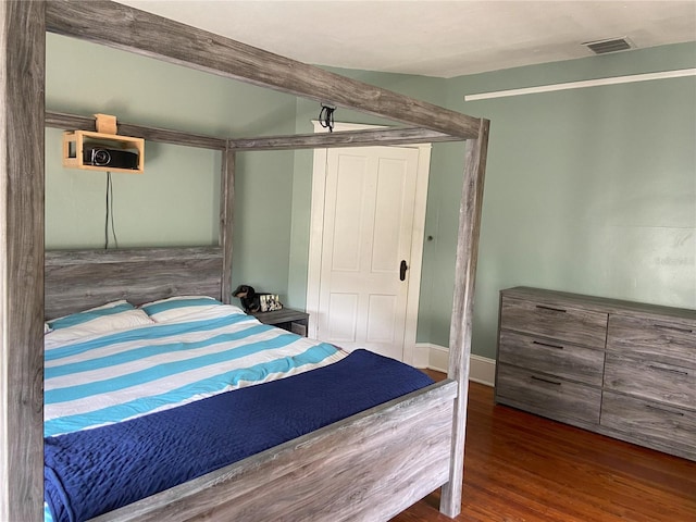 209 E 4th St, Sanford, FL 32771 - bedroom featuring visible vents, wood finished floors, and a closet