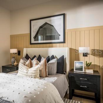 9429 Golden Laurel Ln, Orlando, FL 32827 - bedroom featuring a wainscoted wall