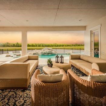 9429 Golden Laurel Ln, Orlando, FL 32827 - view of patio / terrace with outdoor lounge area and an infinity pool