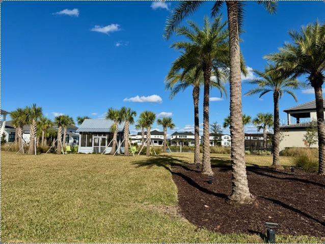 9429 Golden Laurel Ln, Orlando, FL 32827 - view of grassy yard with a sunroom