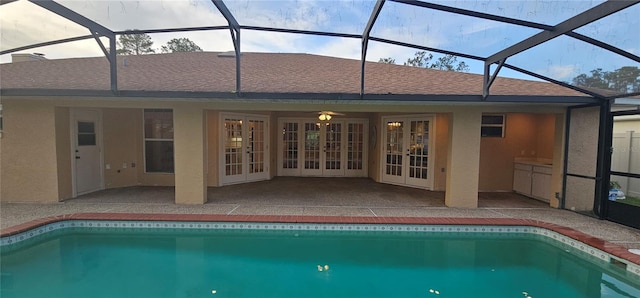 62 Barkley Ln, Palm Coast, FL 32137 - swimming pool featuring french doors, a patio area, and glass enclosure