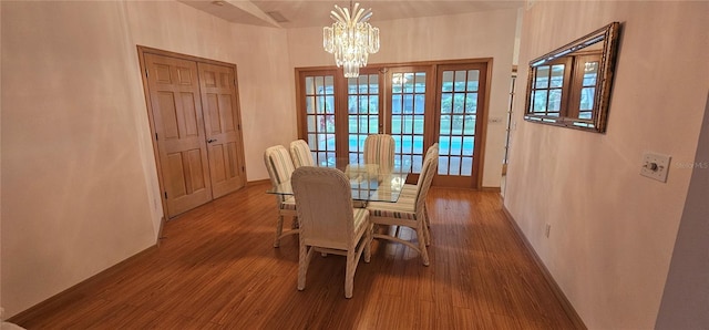 62 Barkley Ln, Palm Coast, FL 32137 - dining room featuring a chandelier, wood finished floors, and baseboards