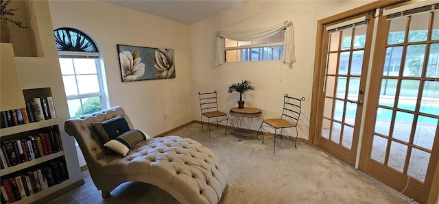 62 Barkley Ln, Palm Coast, FL 32137 - living area featuring carpet flooring, a water view, and baseboards