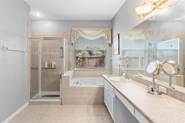 full bathroom featuring a garden tub, vanity, a shower stall, and tile patterned floors