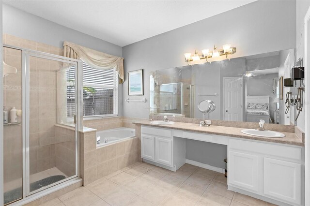 full bath featuring tile patterned floors, a shower stall, double vanity, a bath, and a sink