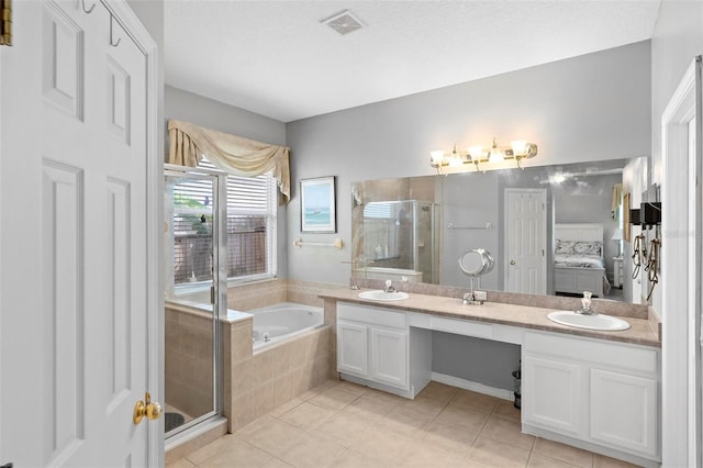 full bath featuring visible vents, a stall shower, a bath, and a sink