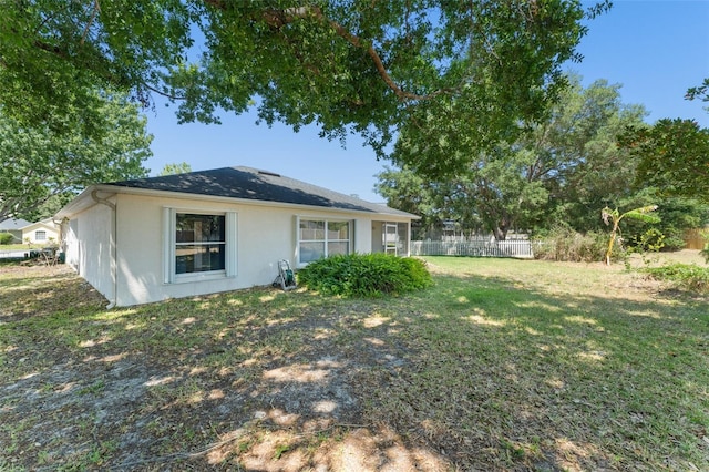 4306 Pebblestone Ct, Orlando, FL 32826 - rear view of house with stucco siding