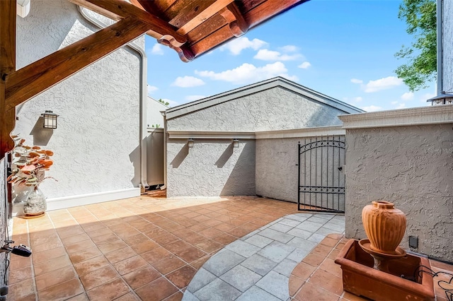 view of patio / terrace featuring a gate